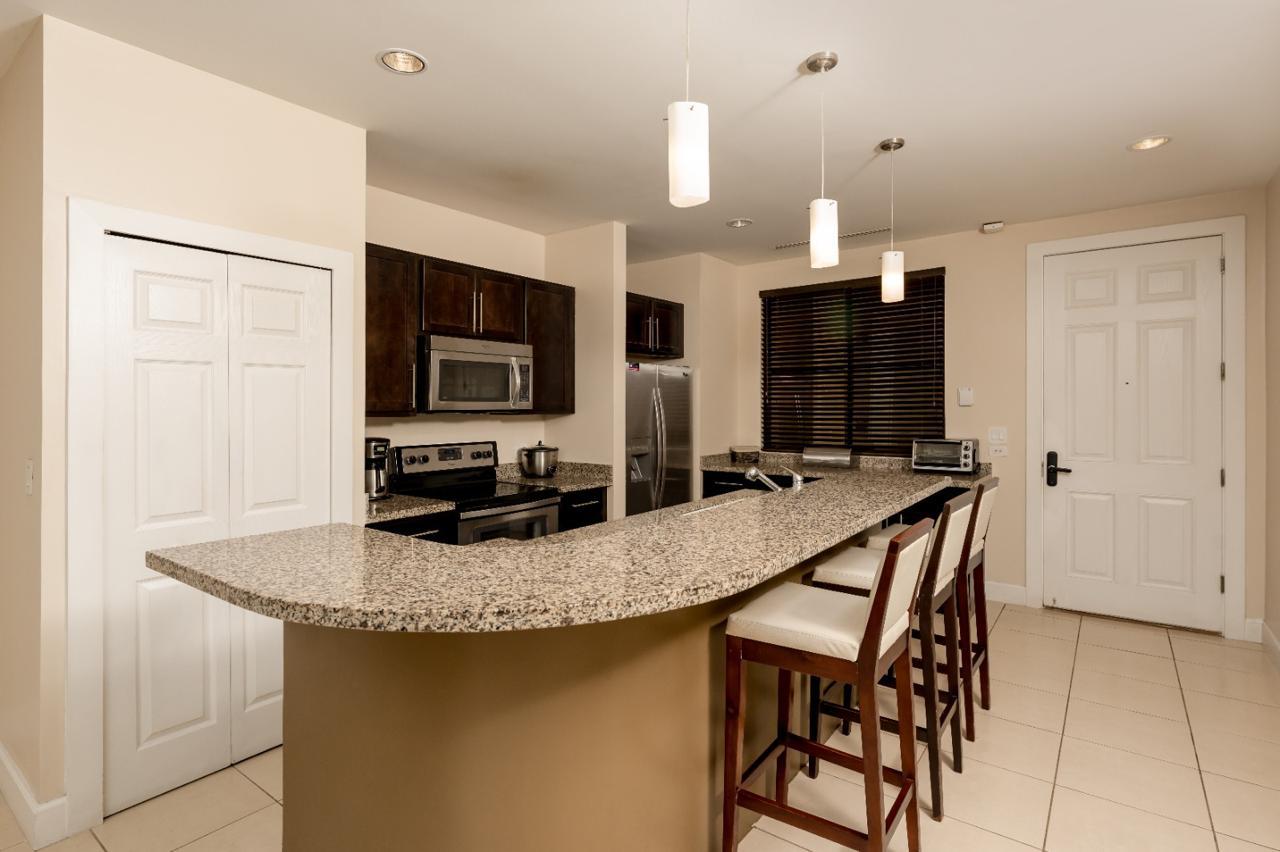 Modern kitchen with granite countertops and breakfast bar