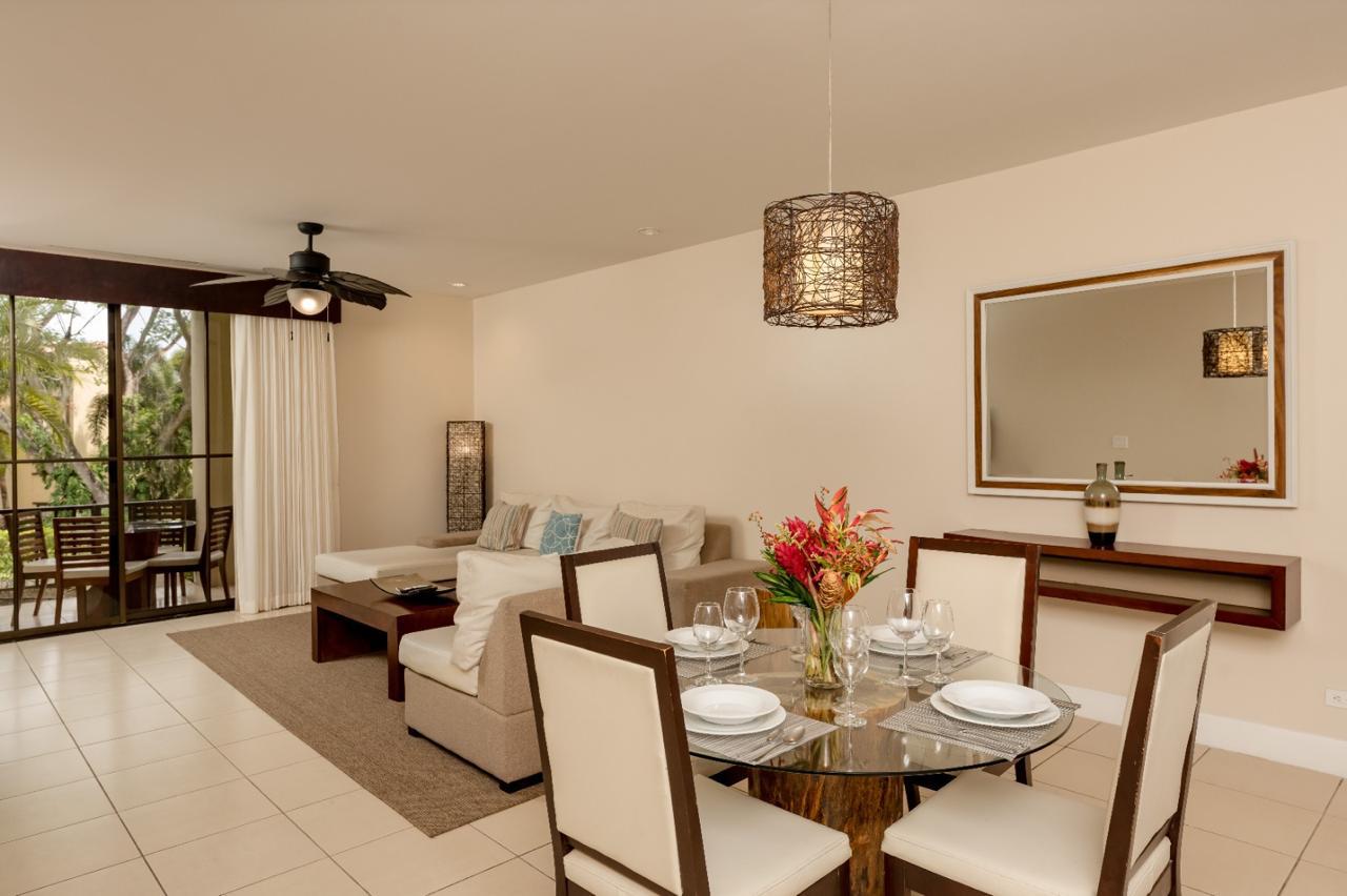 Elegant living and dining area with tropical views
